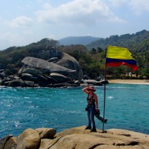 Marion with the Colombian flag on the beach Cabo San Juan